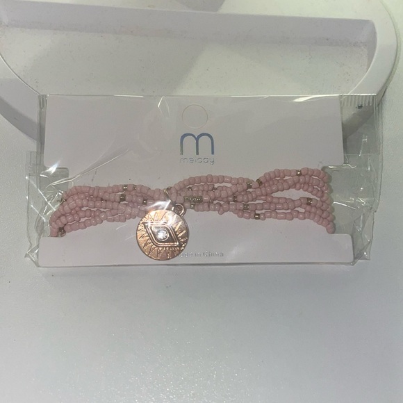 melody Jewelry - Super cute pink stretchy bracelet with gold charms.